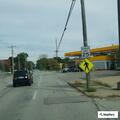 Unit blocking part of eastbound lane due to low-hanging wires after pole incident.
