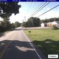 Person hitchhiking near package store in Salem