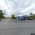 Male walking near railroad tracks to automotive repair