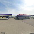 Suspicious people with bicycle at gas station