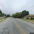 Male jumping at cars near stop sign in Hobart