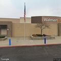 Woman feeling dizzy with headache and nausea at Walmart