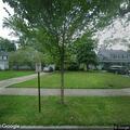 Suspicious person with ladder in backyard