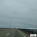 Dark sedan stopped at base of Jamestown Bridge