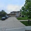 Suspicious van parked beside house in Mokena