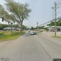 Vehicle crash with fluid leak on Main Street