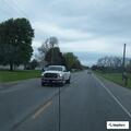 Damaged vehicle with flat tires reported at business