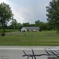 Suspicious woman standing in driveway on Weckerly Rd