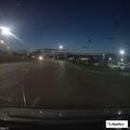 Traffic stop on red Chevy Impala near car dealer