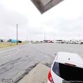 Vehicle stopped with hazards at restaurant