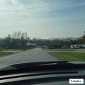 Motorist needs help changing tire on highway shoulder