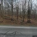 Small brush fire on roadside near quarry