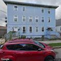 Caller reports intruder and holds machete in home
