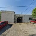 Car broken into at auto shop parking lot