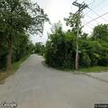Person experiencing back pain near Cottage Row in Midlothian