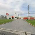 Traffic stop on blue Buick SUV at storage lot