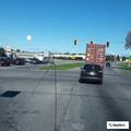 Stopped white pickup on State Road 13 near US 20