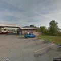People loitering behind store near dumpster