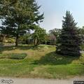 Large tree branch on power line to house