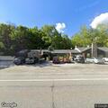 Unregistered small bus left in restaurant driveway