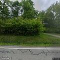 Downed power line and pole in Thompson yard