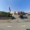 Car stuck on curb at Brayton Avenue coffee shop