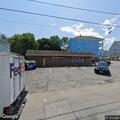 Person sleeping and causing disturbance by dumpsters