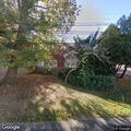 Person knocking on front door at Hillcrest home