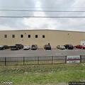 Dumpster fire between buildings at Kana Cabinets