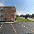 Smell of gas outside three-story residential building