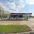 Person reported on gas station roof