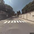 Woman pacing in roadway on Bridge Street