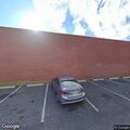 Woman feeling dizzy and lightheaded outside CVS