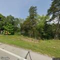 Reckless driver in lime green car nearly hits tree