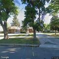 Deer running through neighborhood and roadway