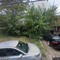 Traffic crash involving black Cadillac sedan