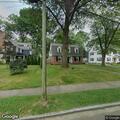 Woman throwing items inside home on Plymouth Road