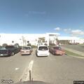 Ambulance en route to hospital at 800 E Washington Blvd