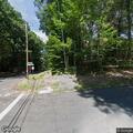 Car possibly hit downed tree on Woodland Drive