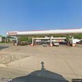 Hit-and-run damage to parked car at gas station