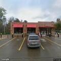 Person in hospital gown appears confused at Sheetz