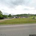Man falls from pickup and breaks leg in roadway