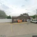 Man screaming and pulling generator near business