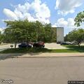 Person sleeping in truck at shopping plaza