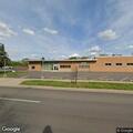 Officers check report of fire behind service center