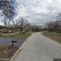 Person experiencing chest pain at Oak Brook intersection