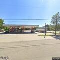 SUV hits pole at convenience store parking lot