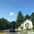 Disabled car with flat tire on Route 209