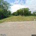 Officer checks black Cadillac Escalade in park
