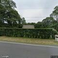 Tree fallen into utility wires on Massasoit Road